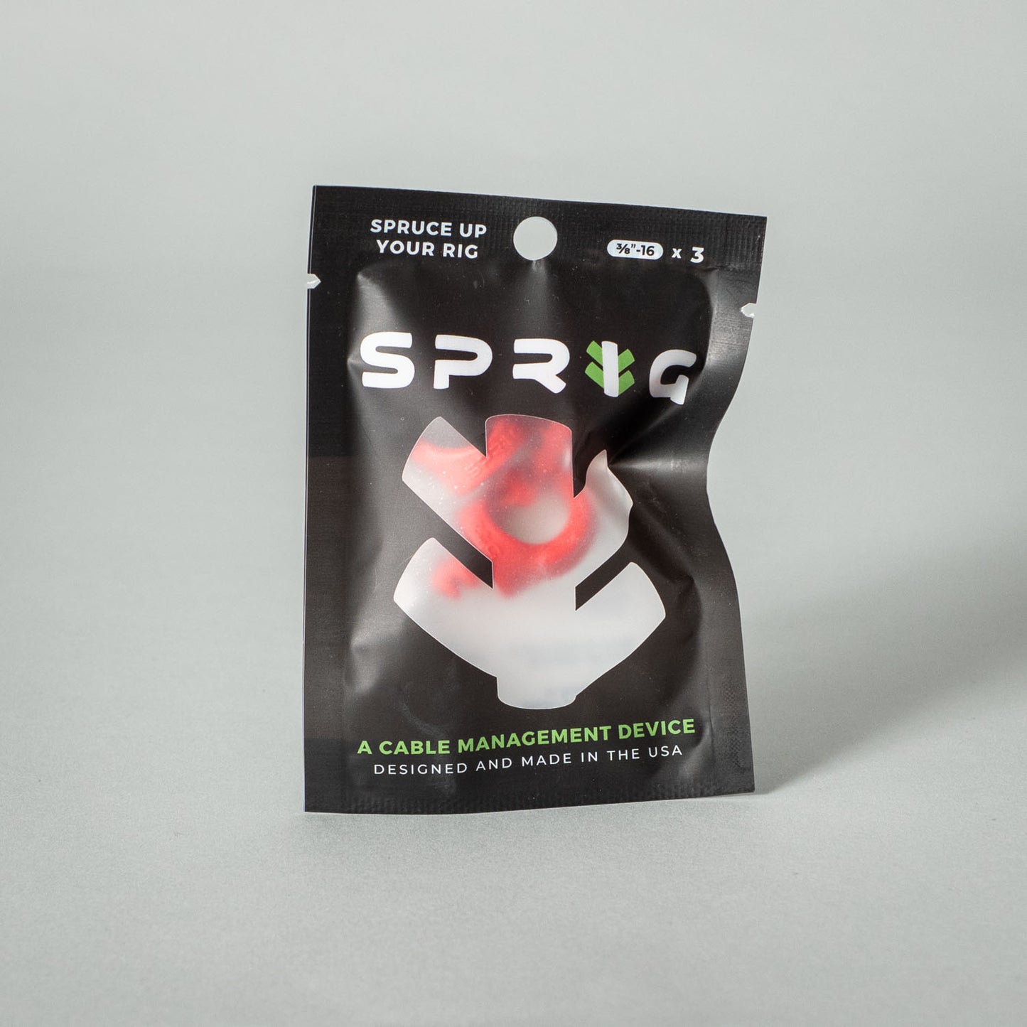 Flexible Kabelclips von setbedarf, grüne und transparente Clips zur sicheren Kabelführung und Organisation.